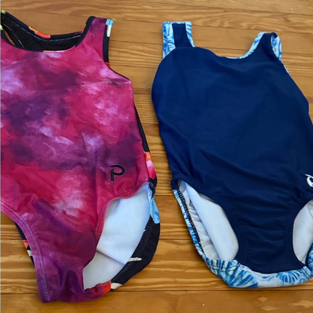 Two plum CM leotards
